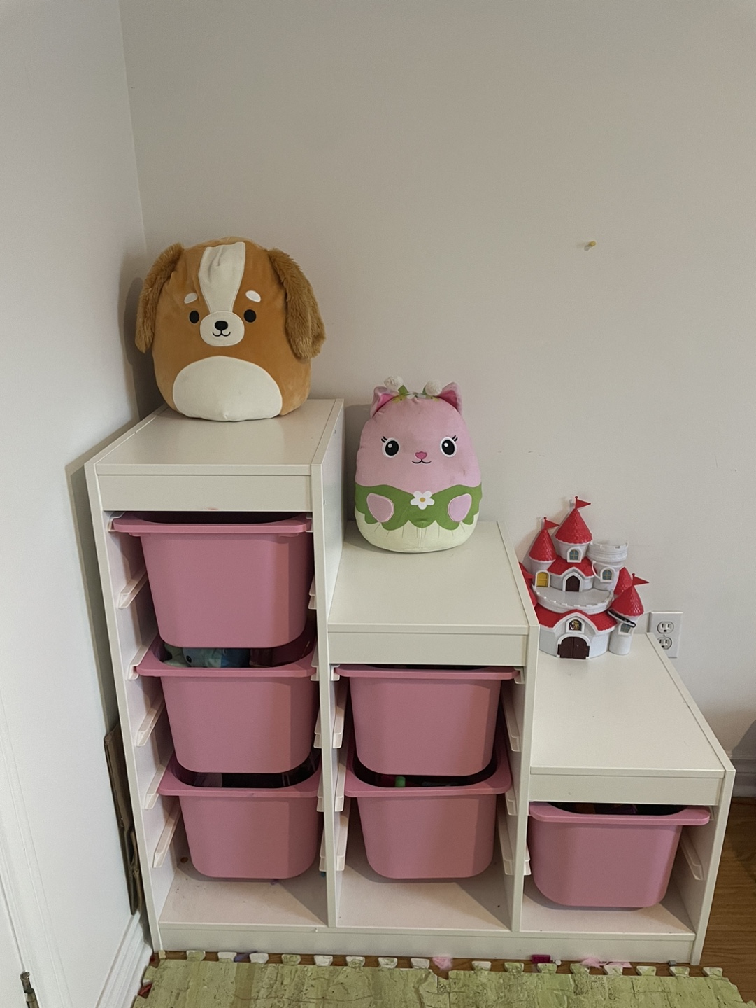 White children's toy organizer with pink bins