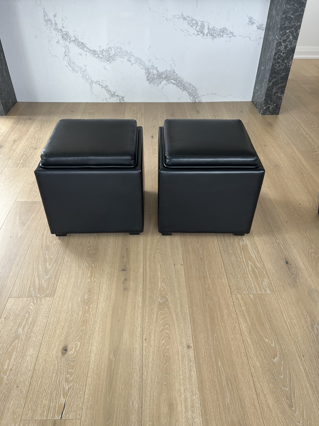 Three Black Leather Storage Ottomans