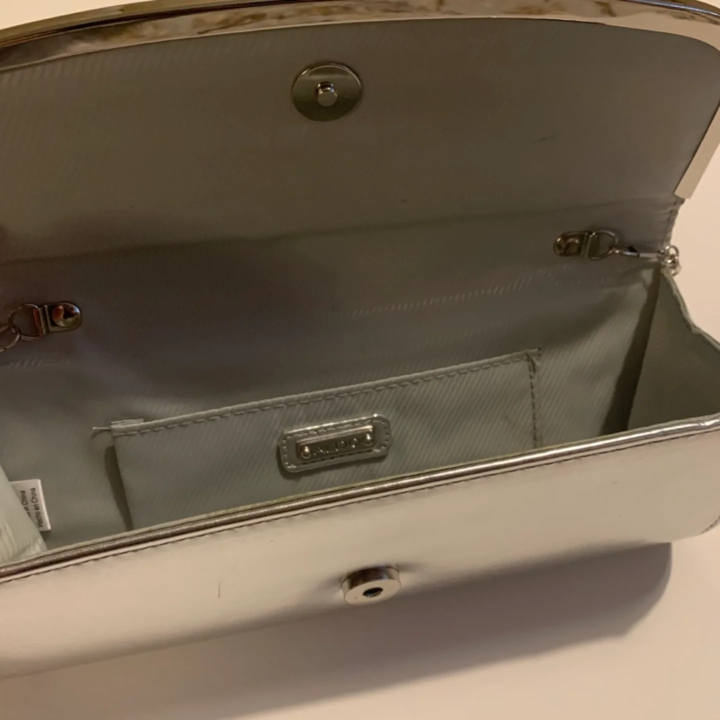 Aldo Silver metallic clutch purse image indicator(2)