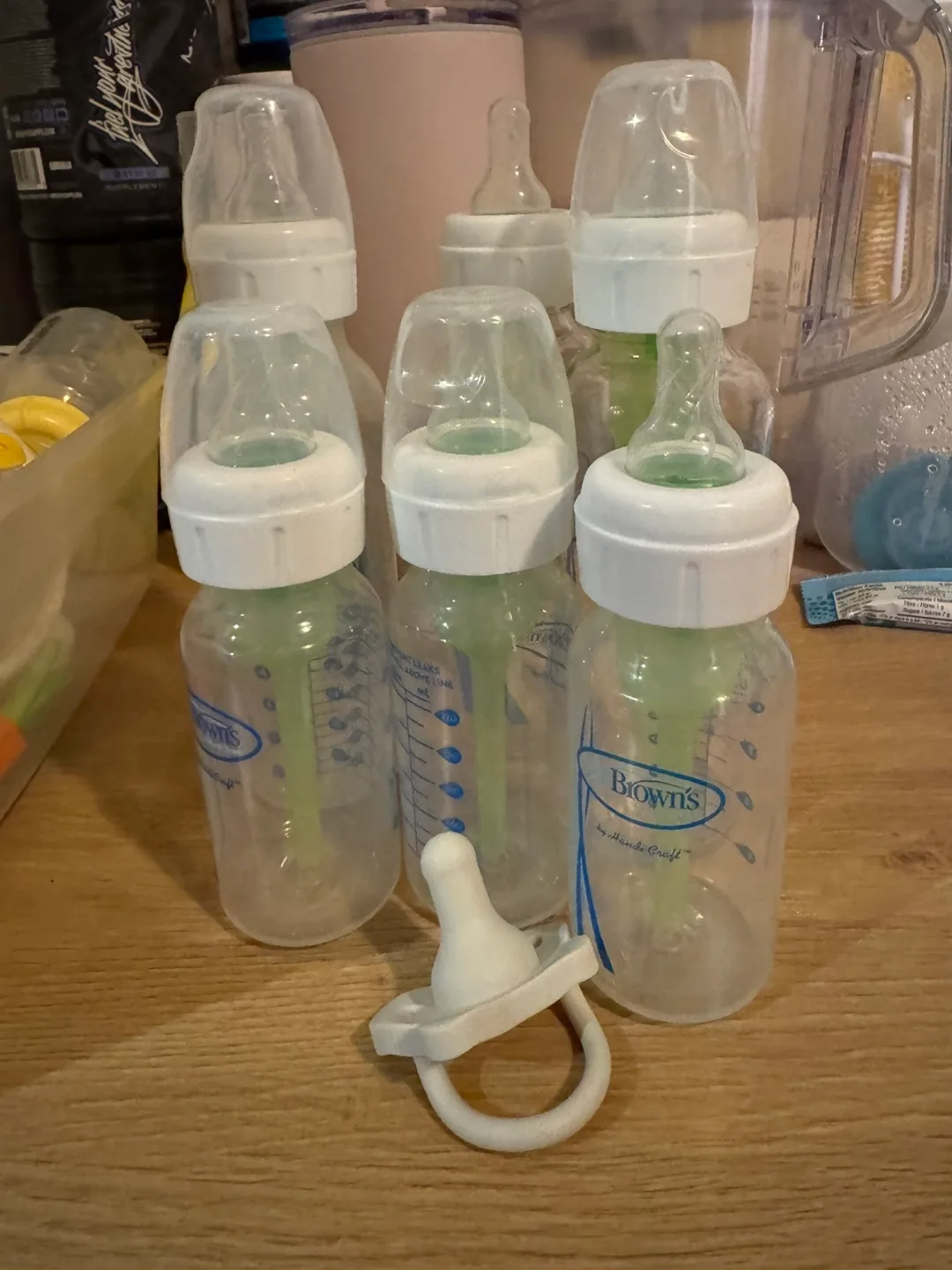 Five Baby Bottles and One Pacifier thumbnail