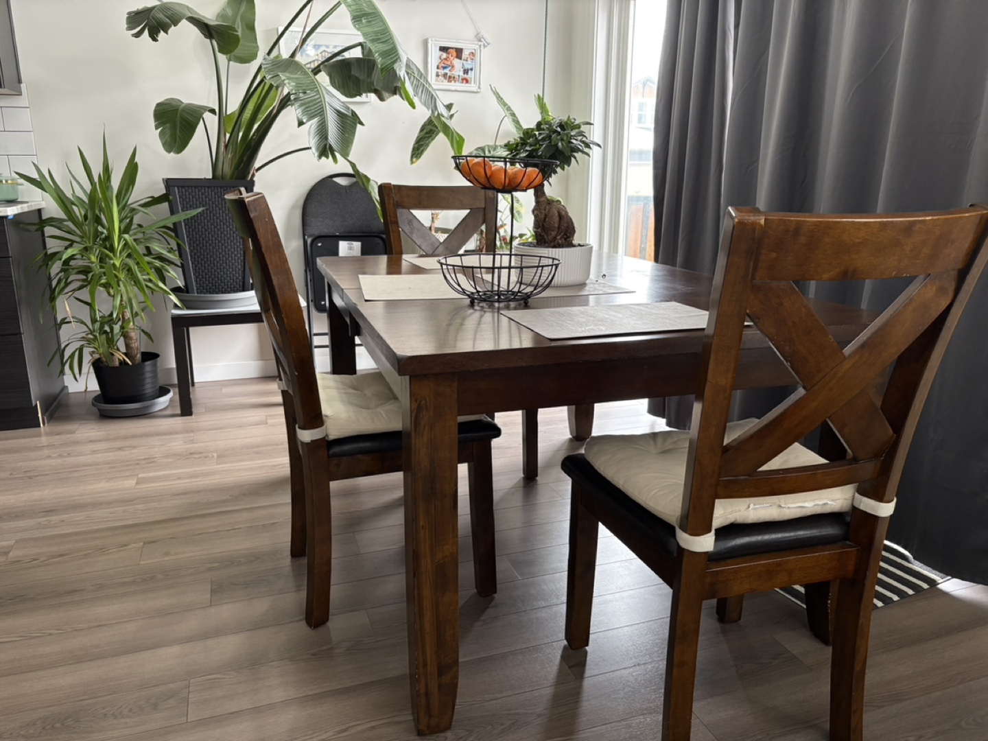 Dark Brown Wood Dining Table and Three Chairs