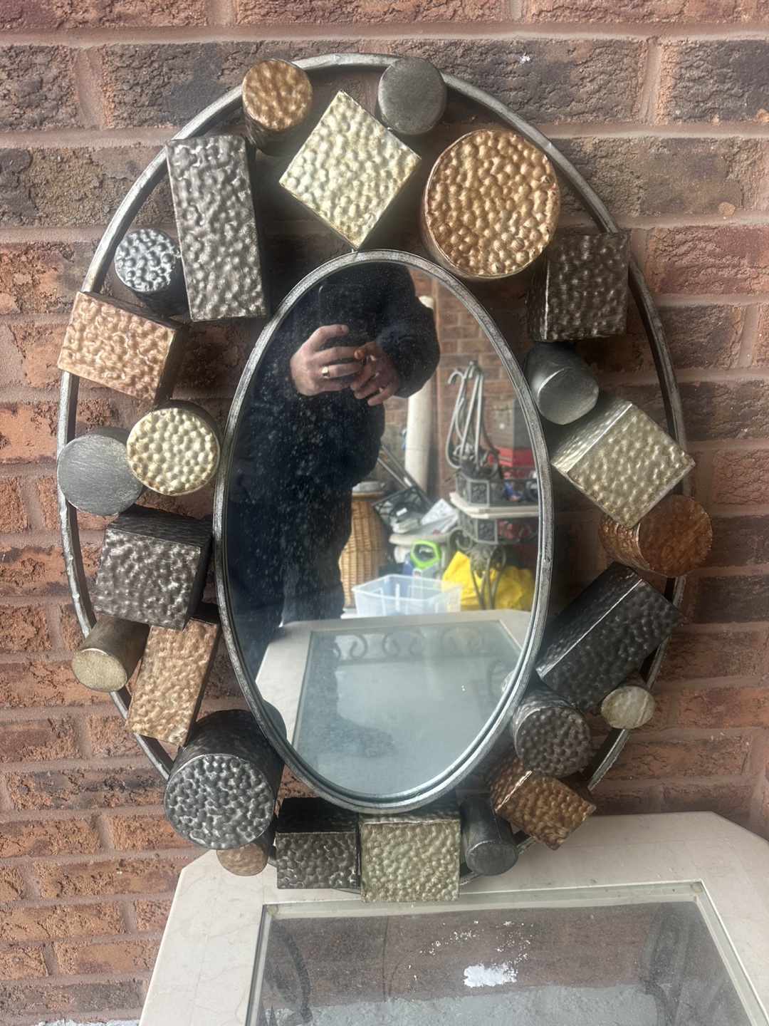 Oval Metal Mirror with Geometric Design
