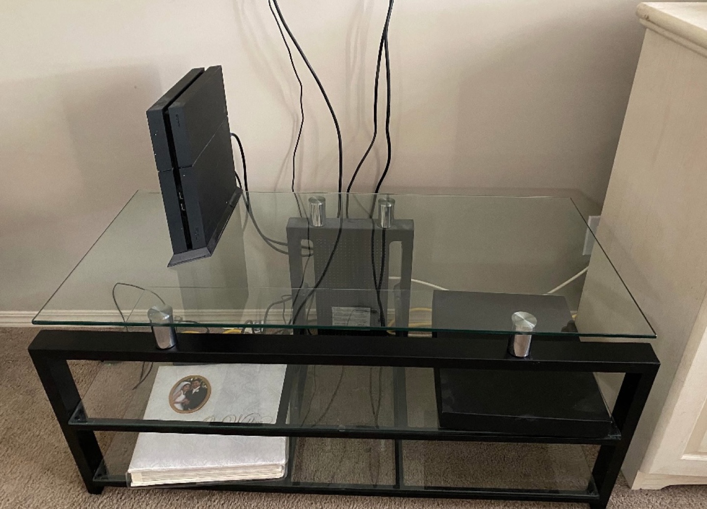 Glass top coffee table with black metal frame