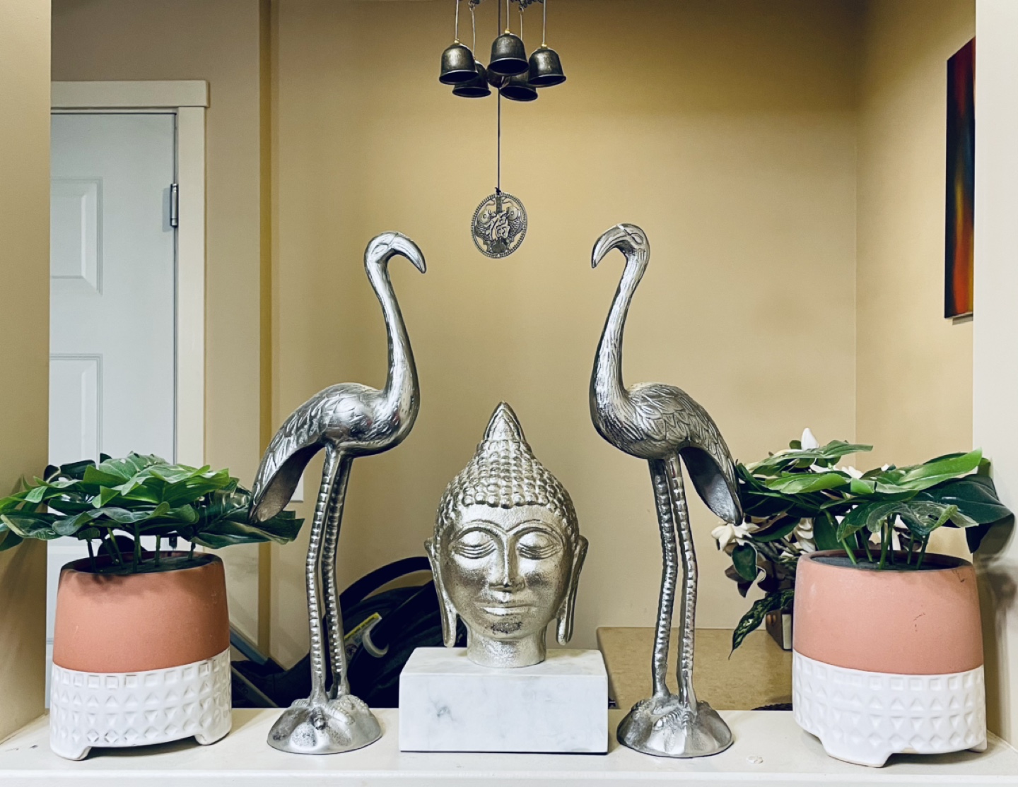 Pair of Silver Metal Cranes and Buddha Head Statue