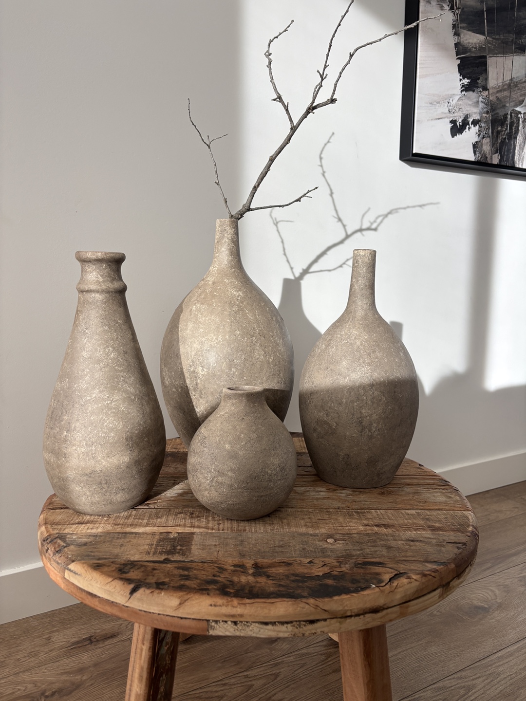 Set of four grey stone vases