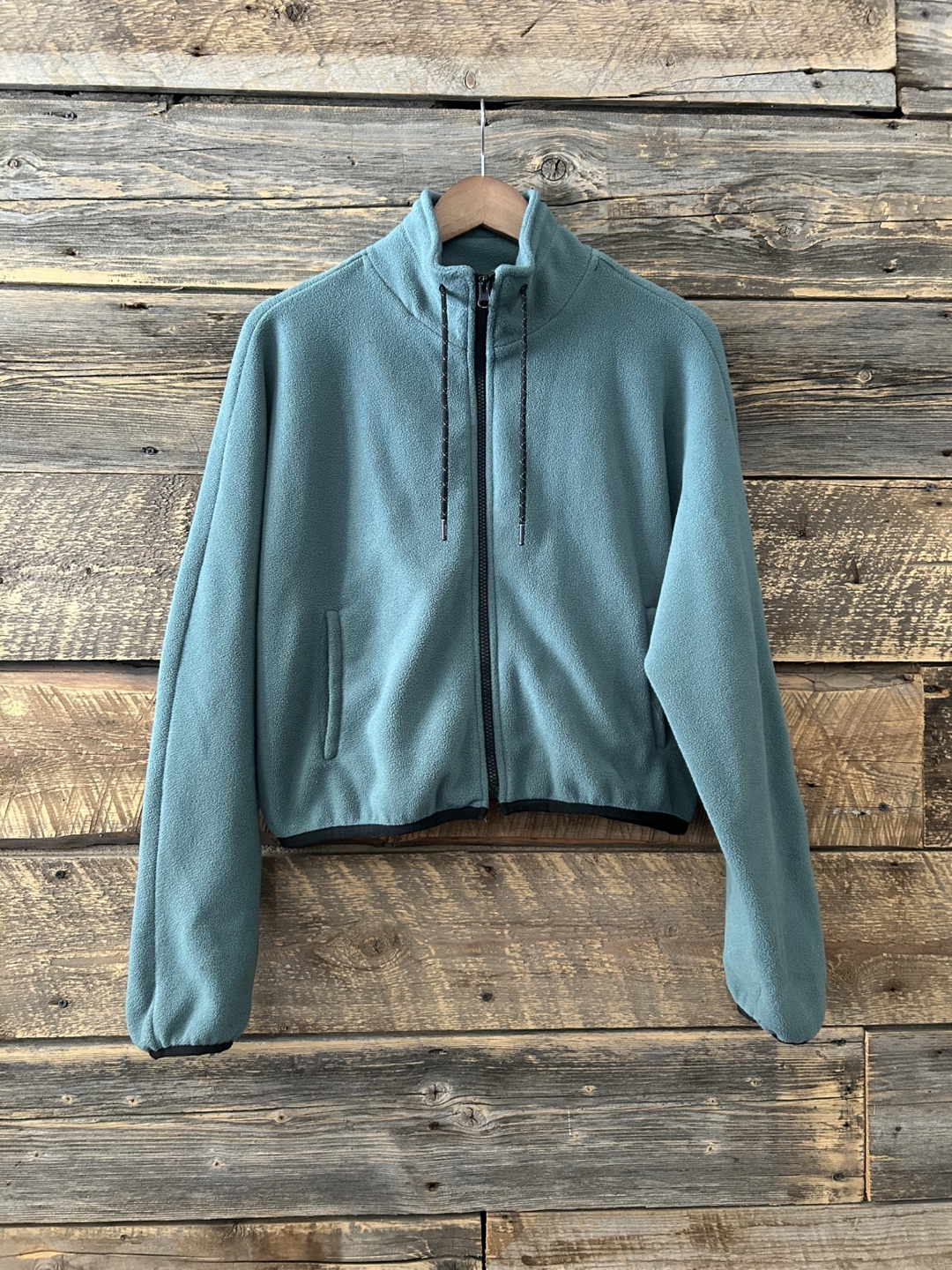 Women's cropped teal fleece zip-up jacket