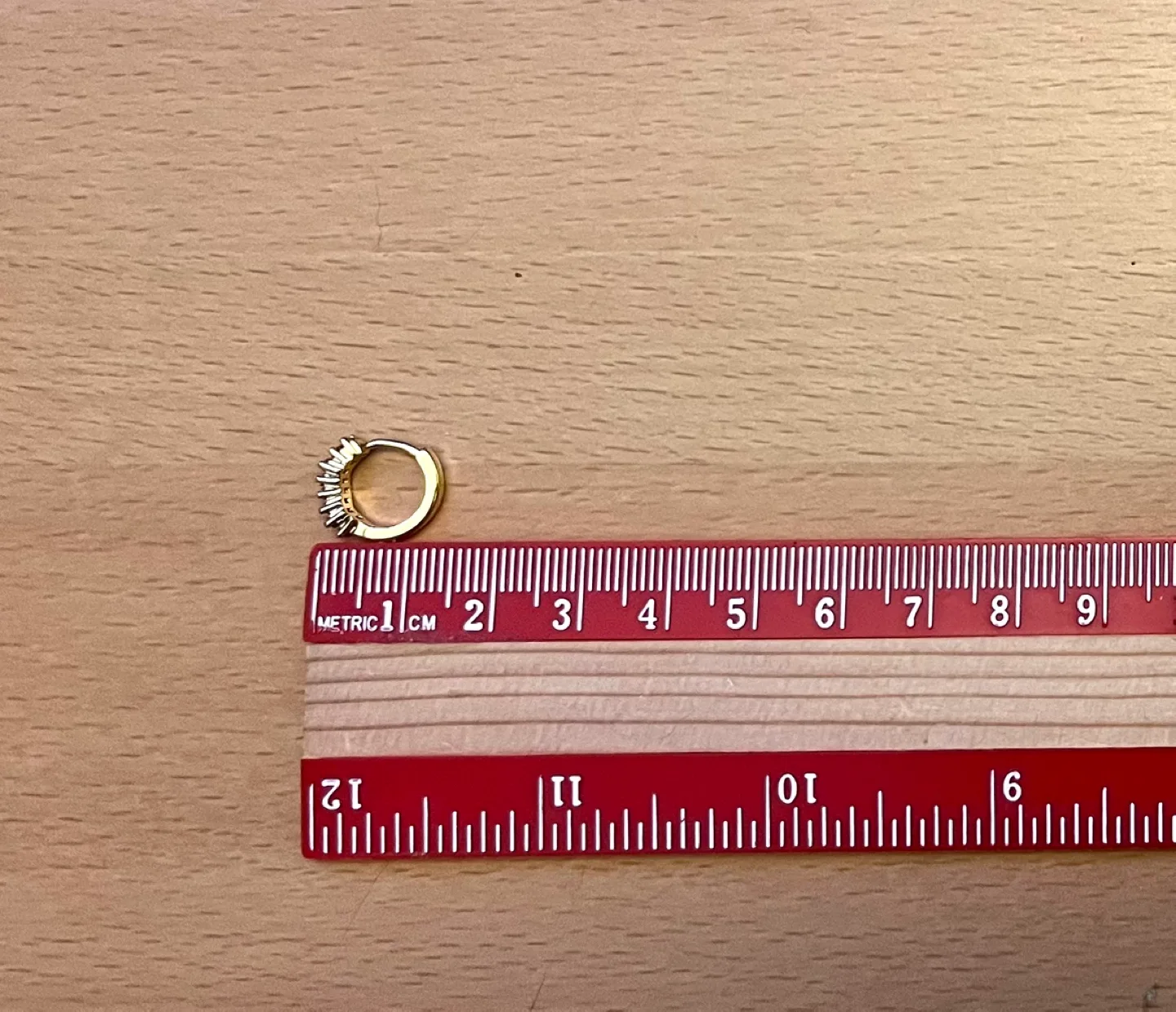 Gold Huggie Earrings with Pink Cubic Zirconia image indicator(5)