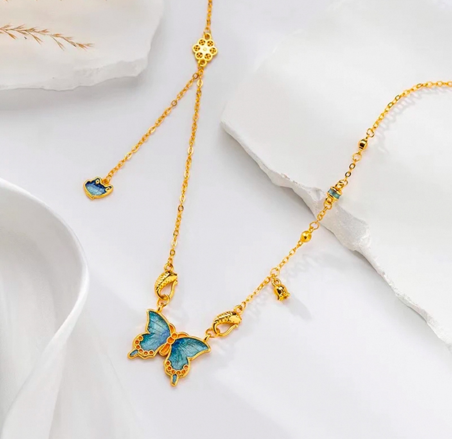 Delicate Gold Butterfly Necklace with Blue Enamel Accents