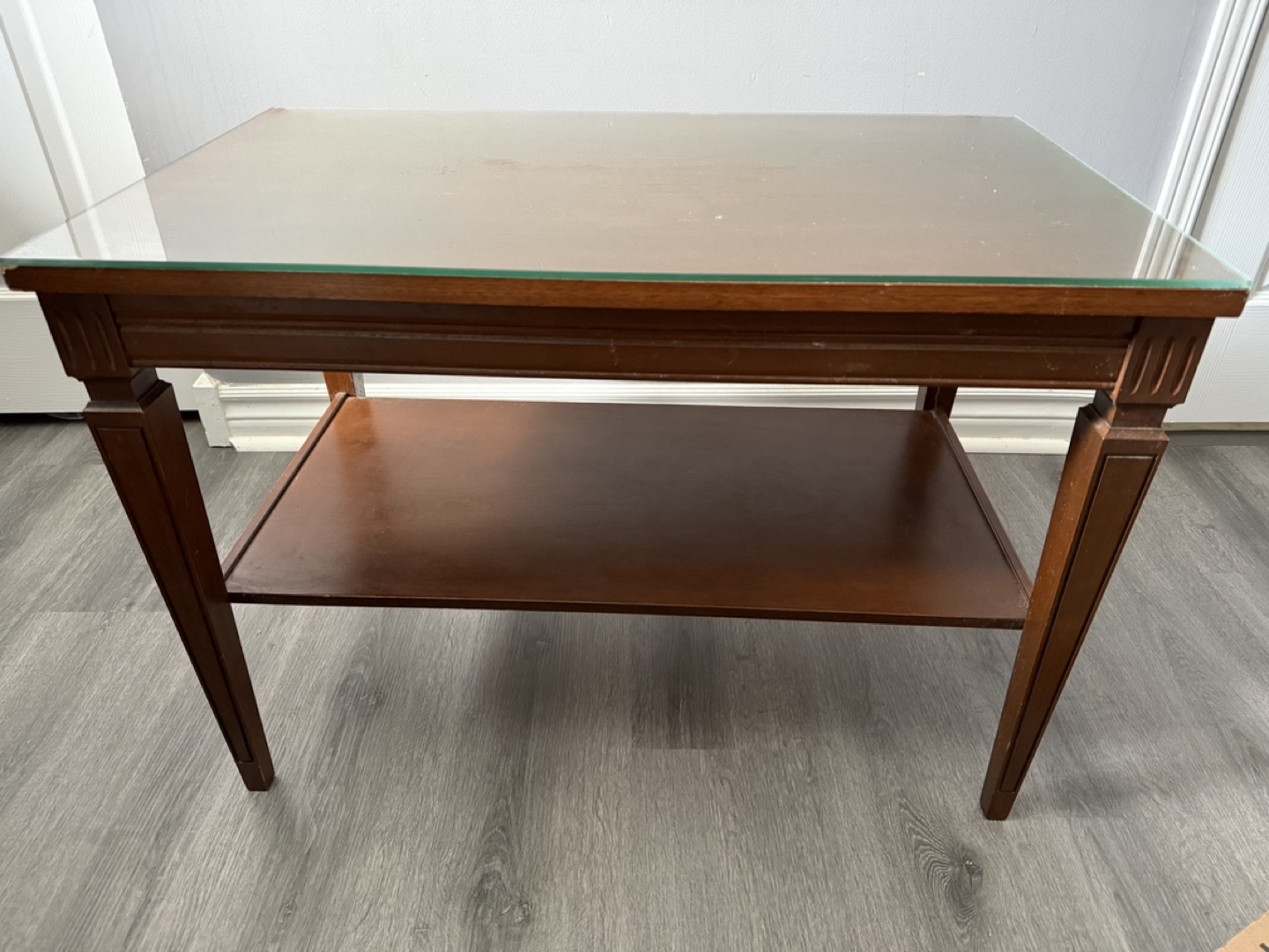 Wooden side table with glass top