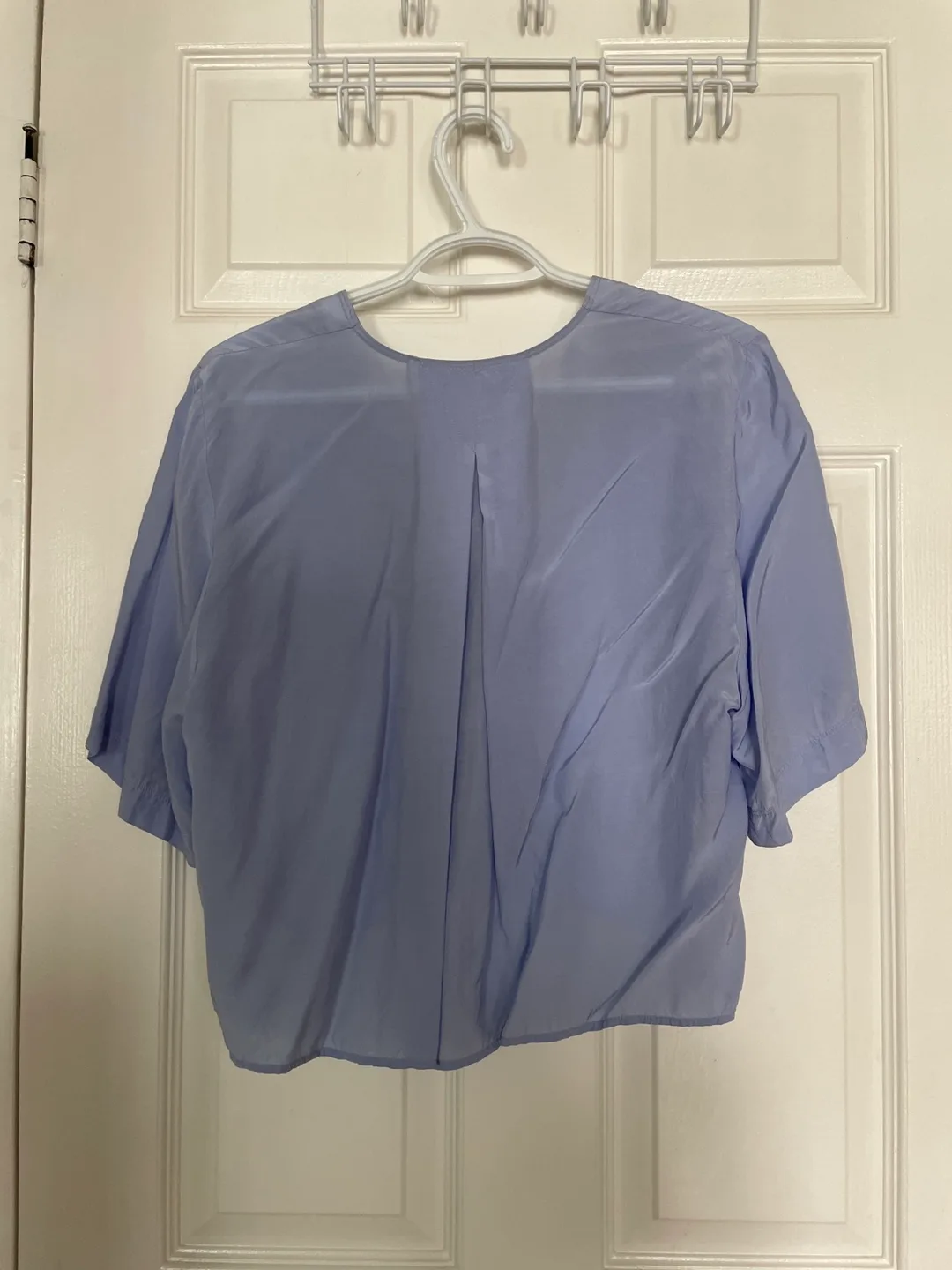 Light blue cropped button-up blouse image indicator(2)