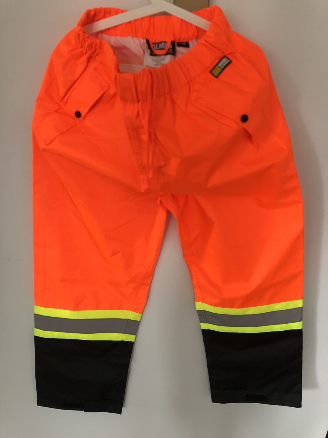 High-visibility orange rain pants - photo 4