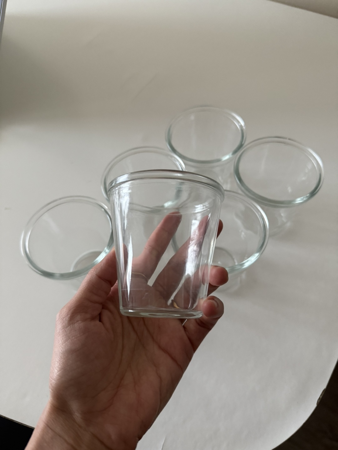 Set of five small clear glass ramekins