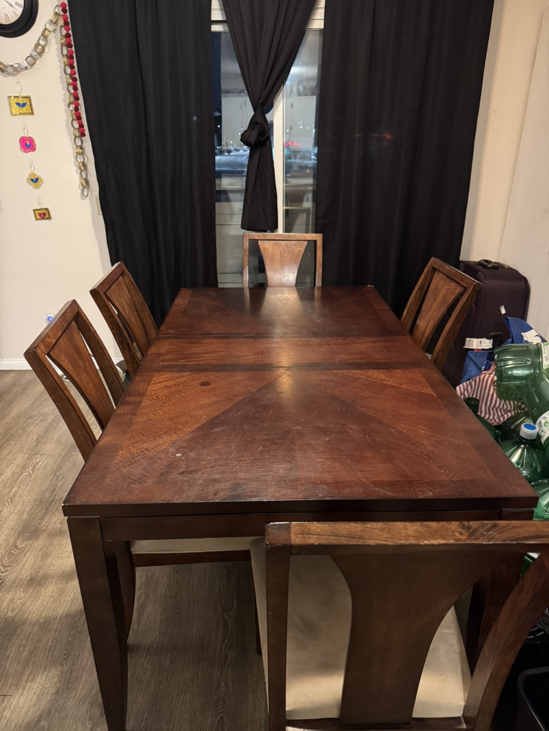 Dark brown wood dining table and six chairs