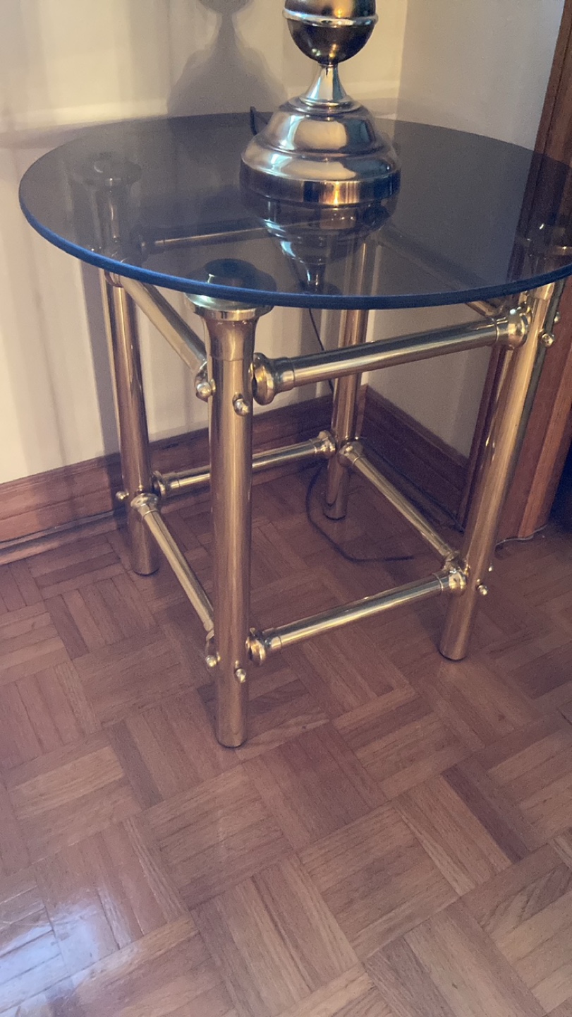 Brass framed side table with round smoke glass top