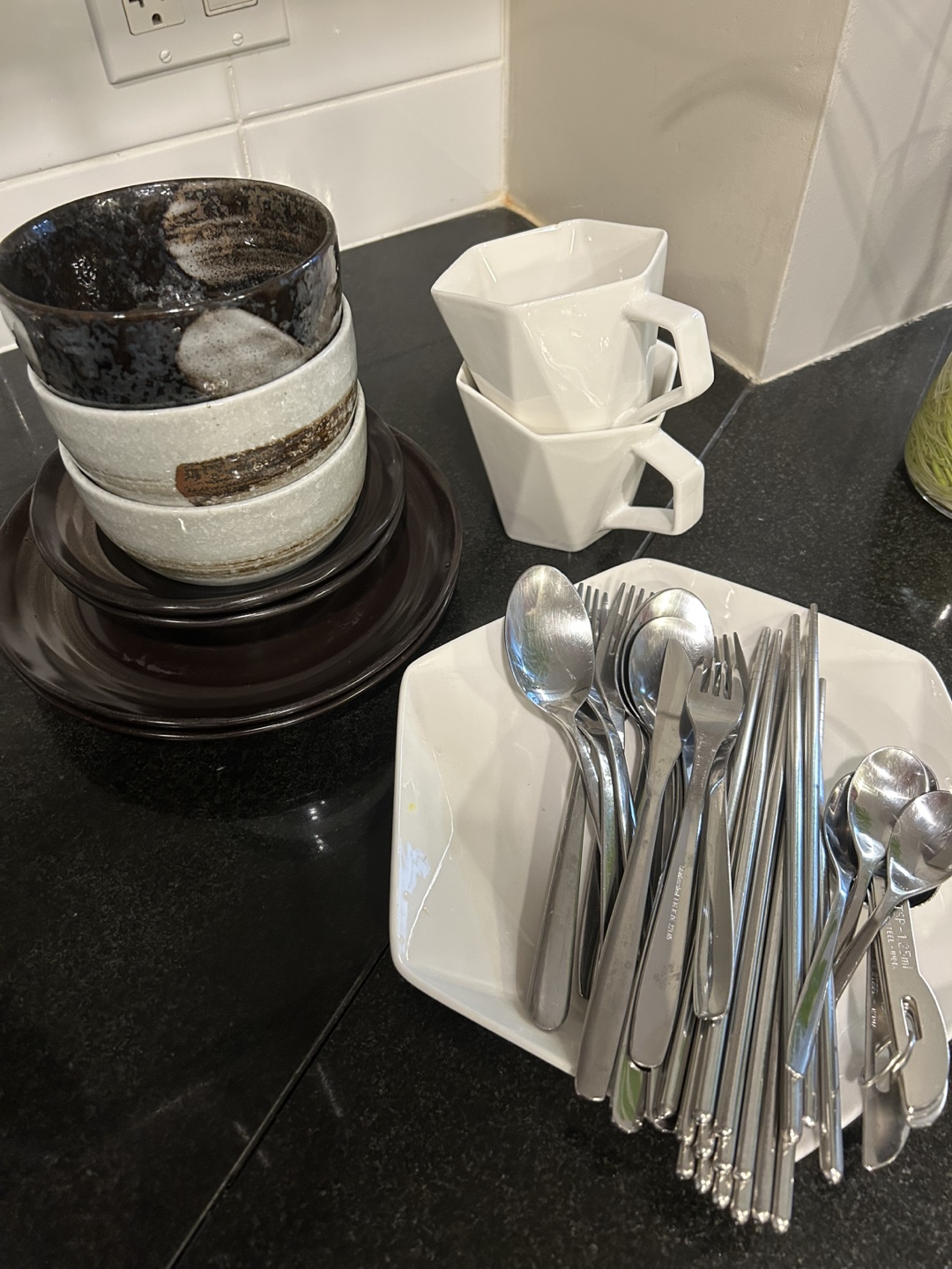Japanese-style bowls, modern mugs, cutlery set