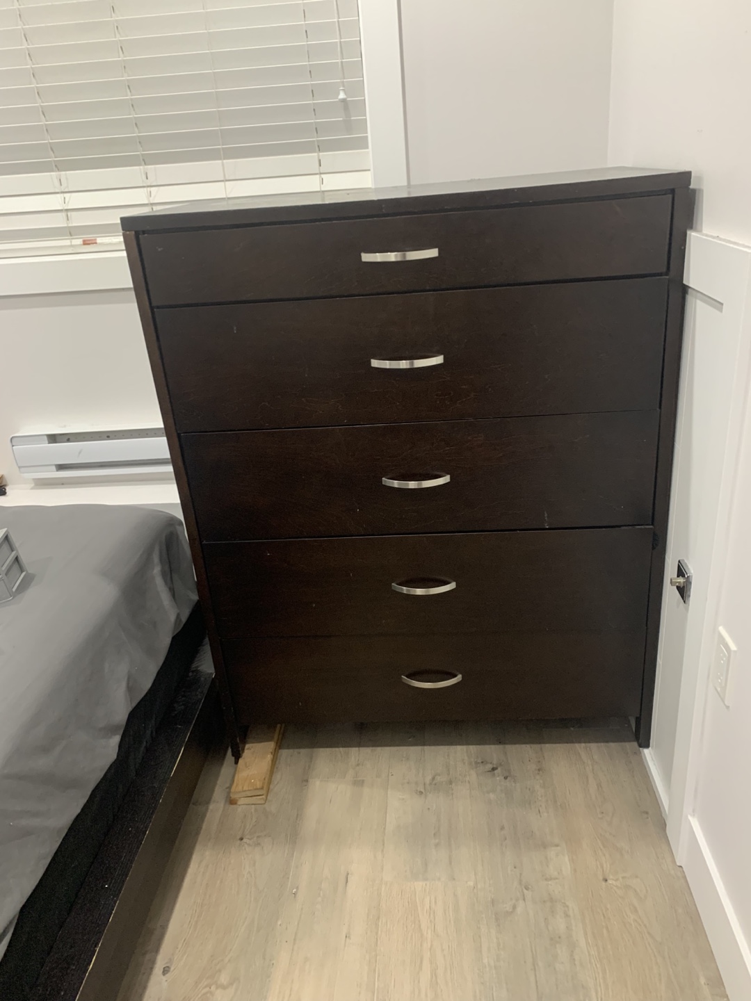 brown five-drawer dresser