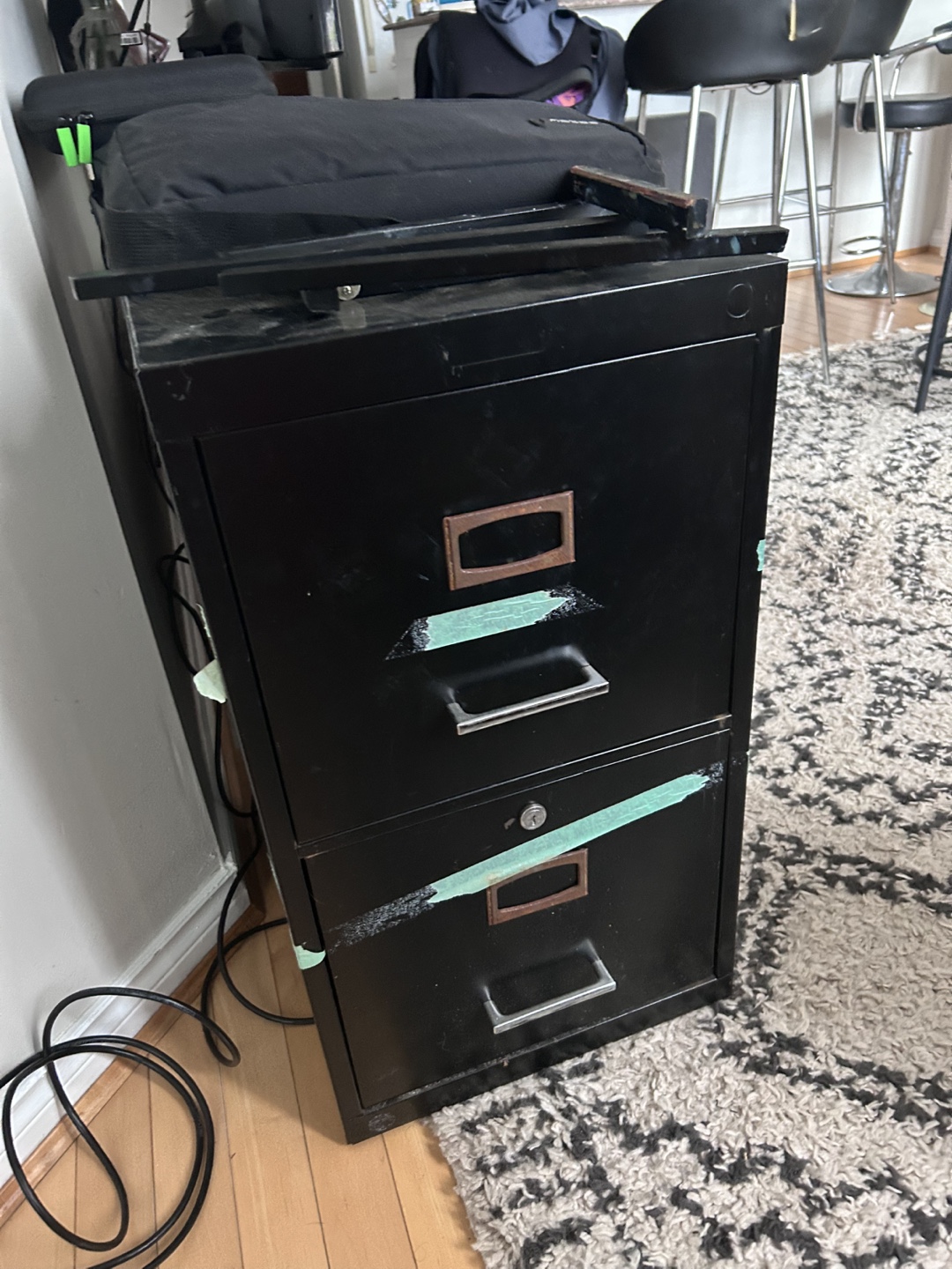 Black metal two-drawer filing cabinet