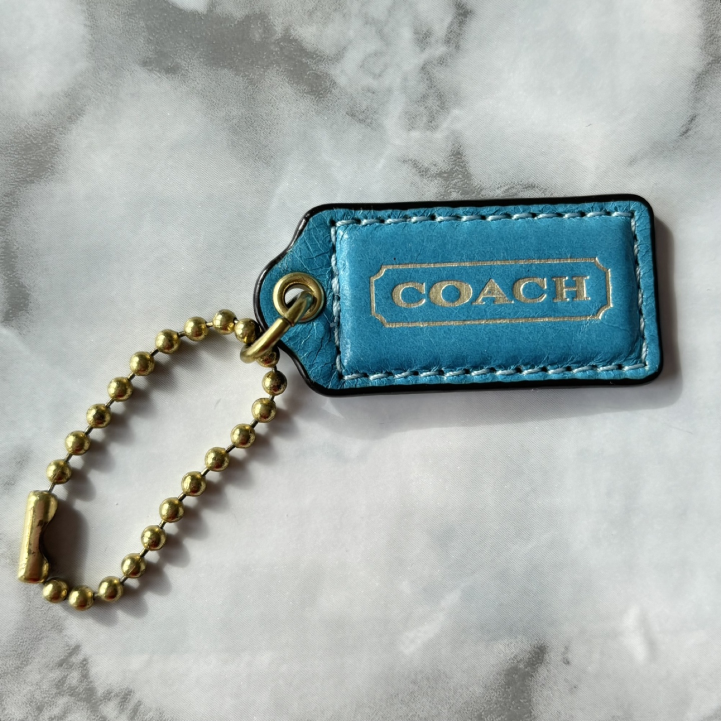 Coach Small Leather Hangtag in Turquoise with Brass Hardware