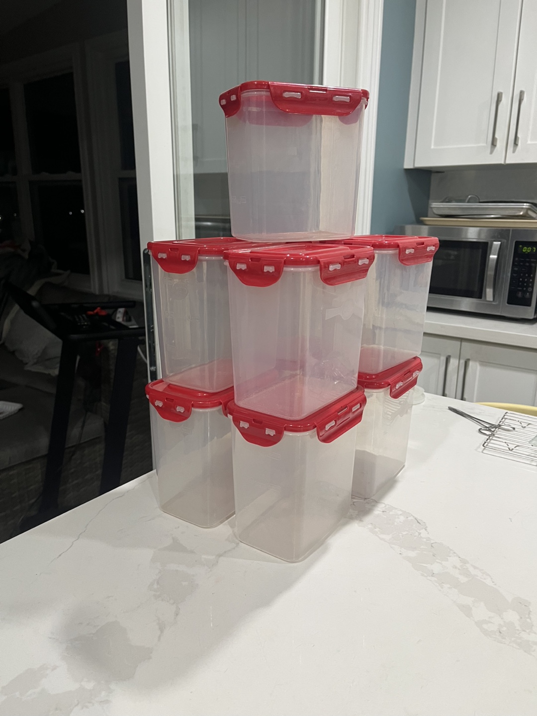 Nine Clear Plastic Food Storage Containers with Red Lids