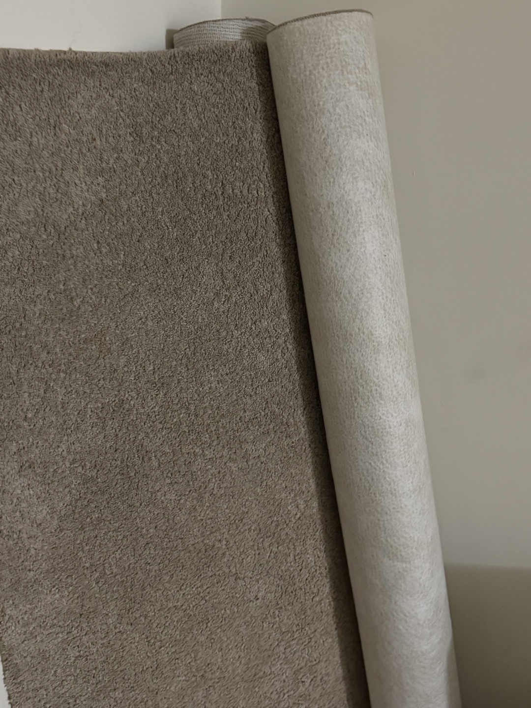 Two Rolled-Up 5x7 Carpets – Beige