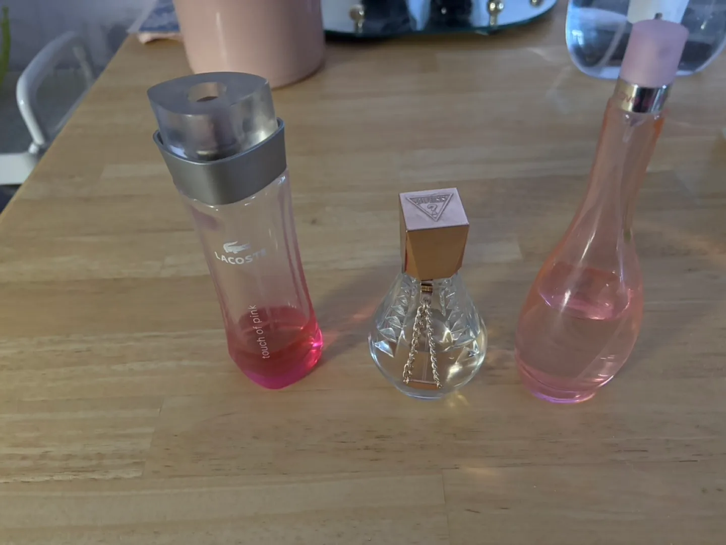 Three Women's Perfume Bottles - Lacoste, Guess, and Unbranded image indicator(2)