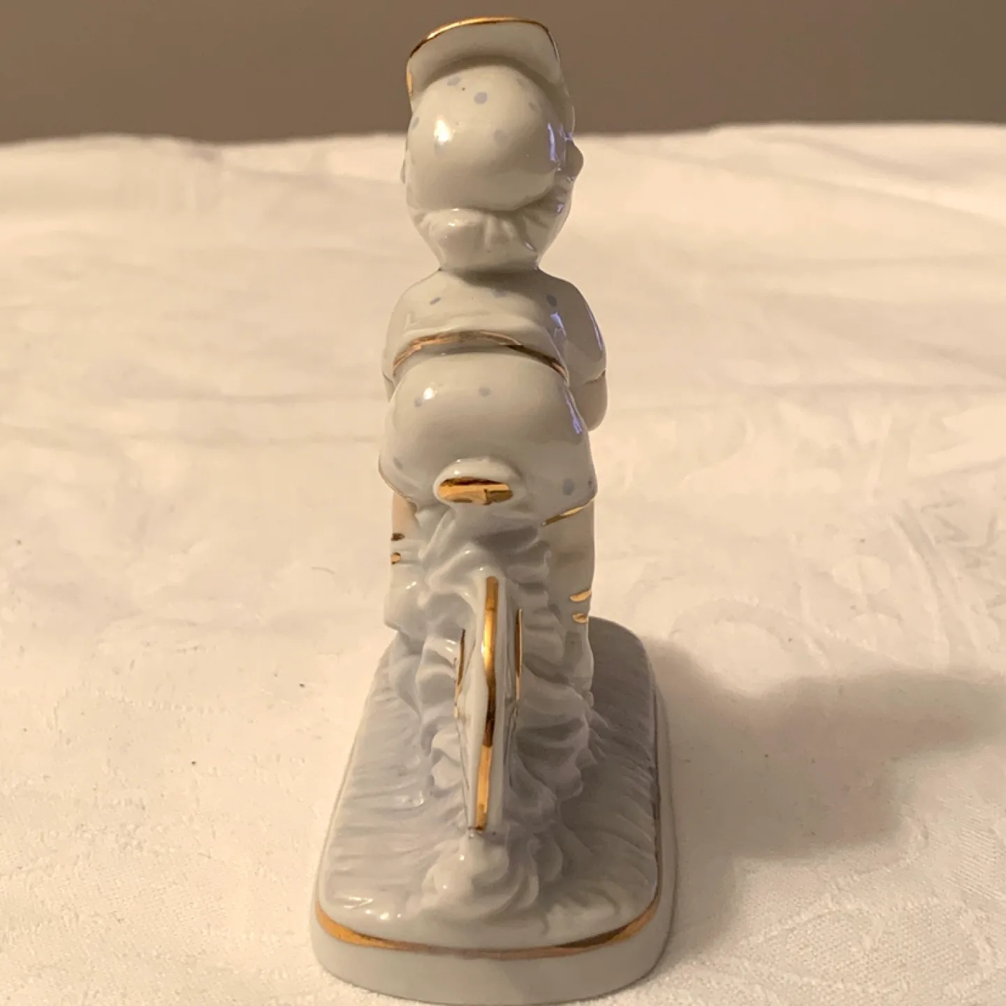 Vintage Porcelain Figurine of Child on Bicycle image indicator(3)