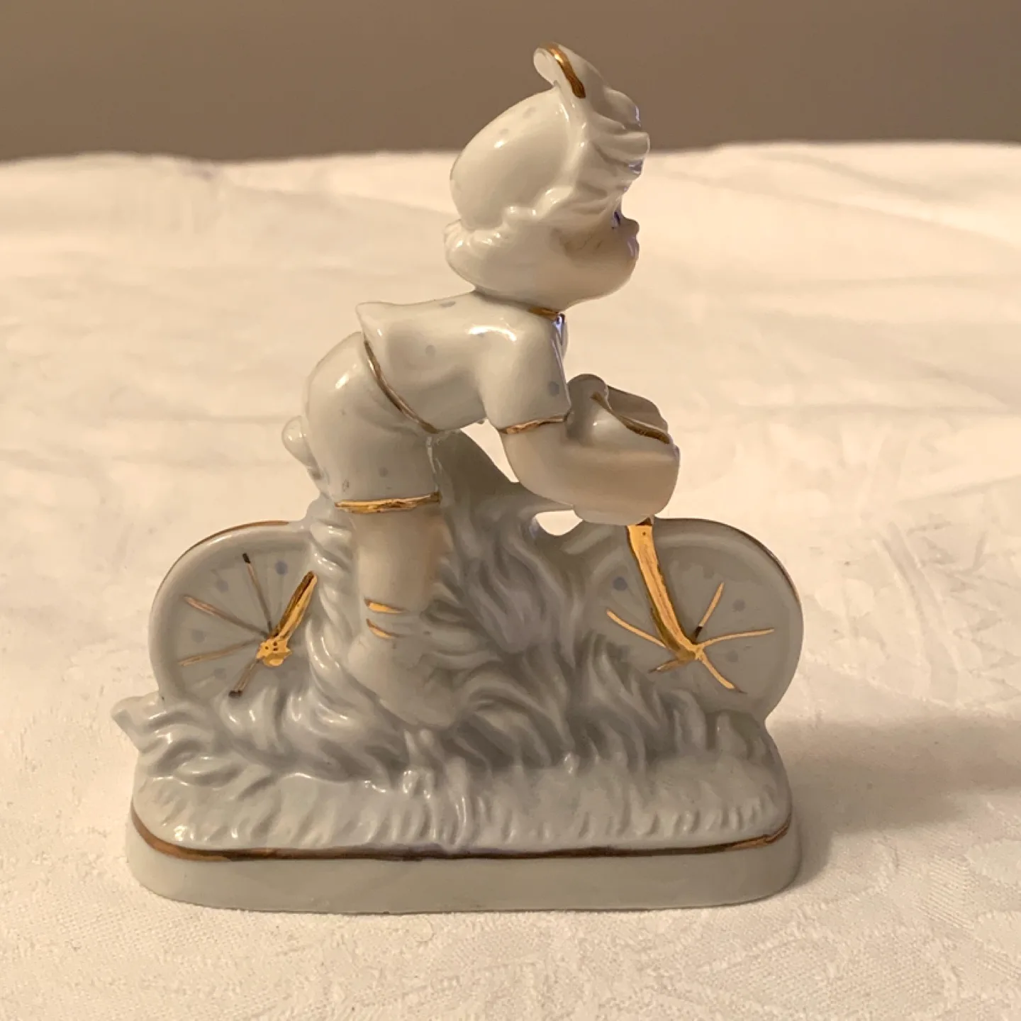Vintage Porcelain Figurine of Child on Bicycle image indicator(4)