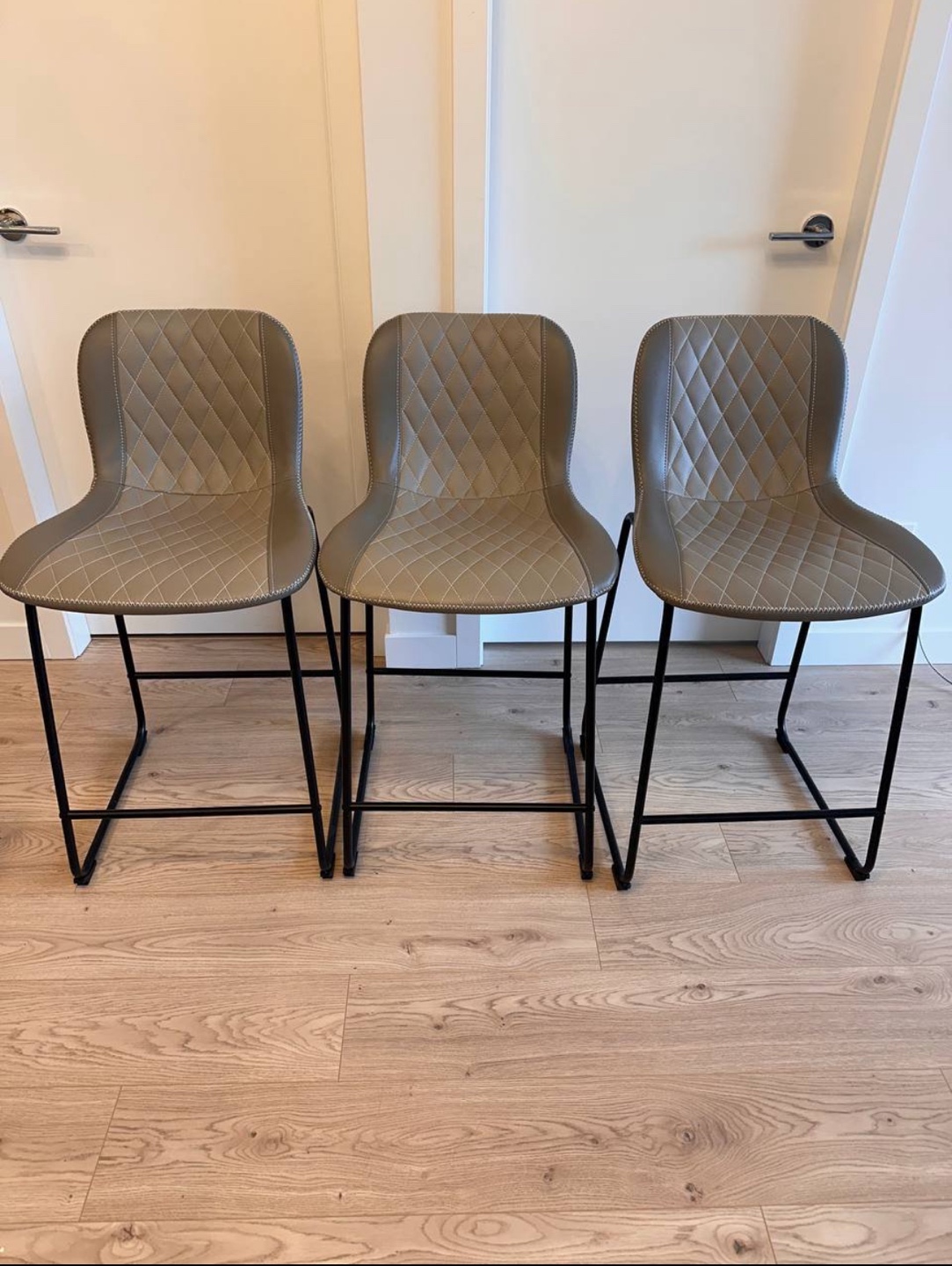 Set of Three Grey Quilted Bar Stools
