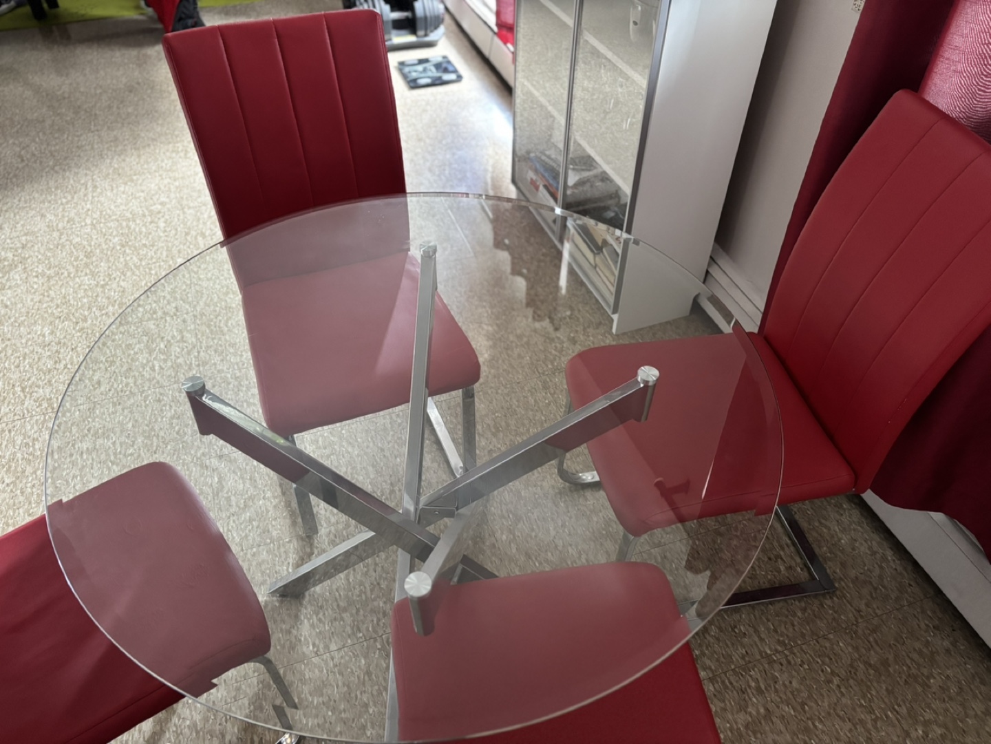 Glass-top dining table and four red chairs - photo 2