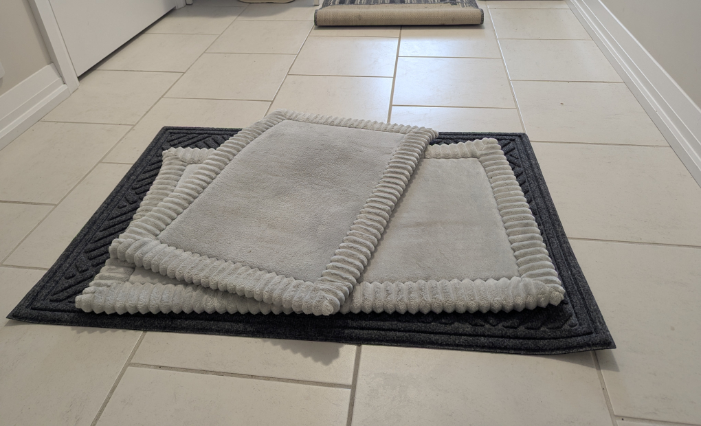 Two bath mats and one doormat