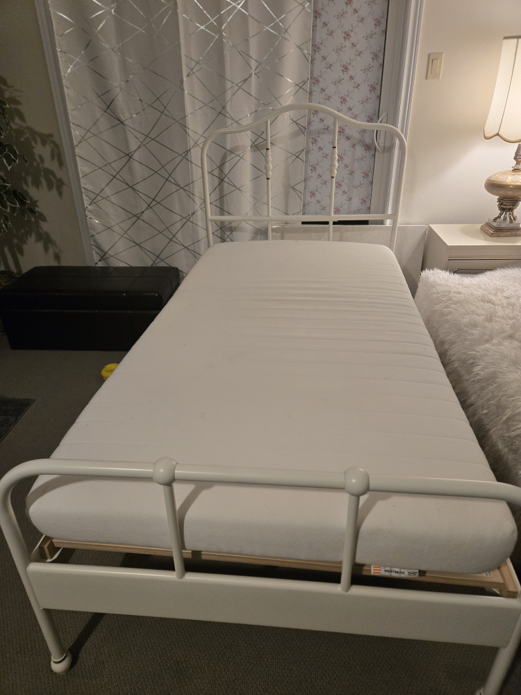 single white metal bed and mattress front IKEA - photo 5