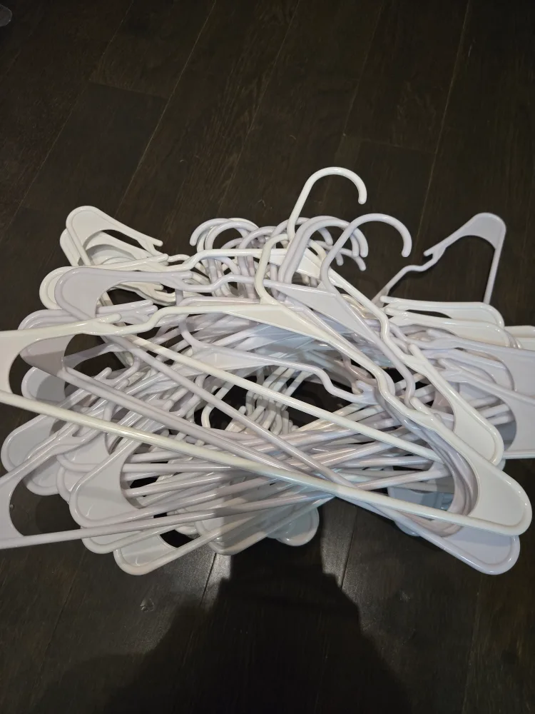Bulk lot of white plastic hangers thumbnail