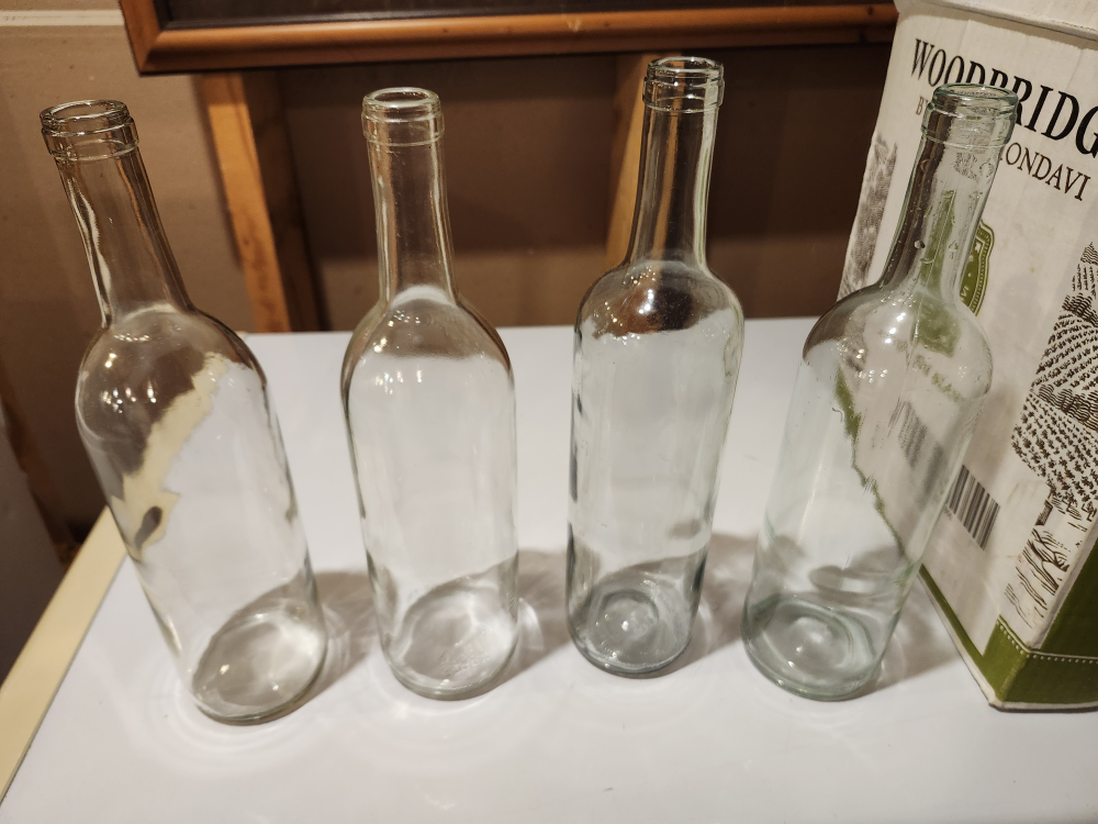 4 boxes of clean clear wine bottles