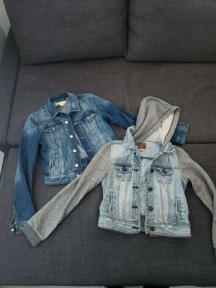Two denim jackets, one with hoodie sleeves