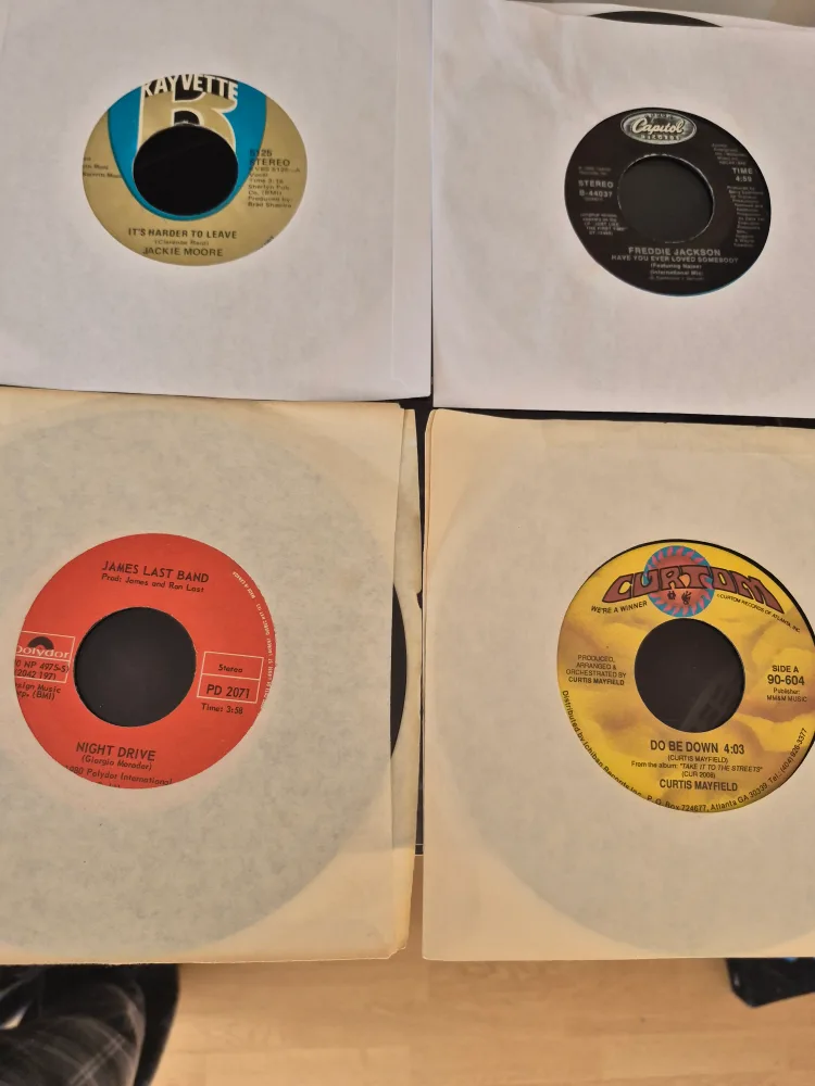 Collection of 12 Vintage 45 RPM Records image indicator(10)