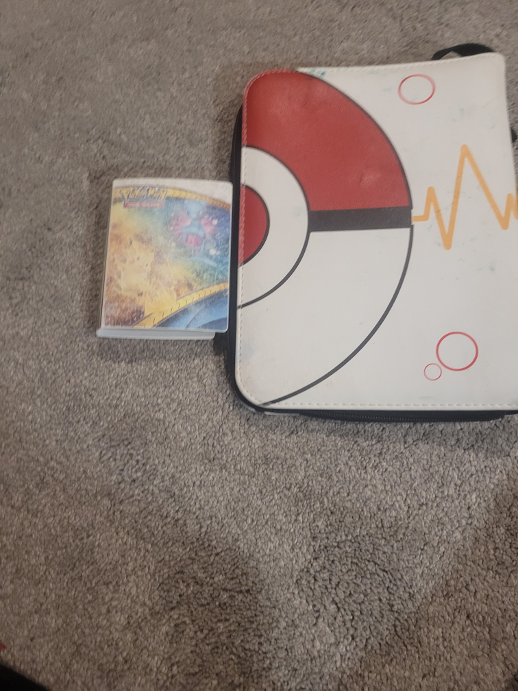 binder for Pokemon and one little hand book