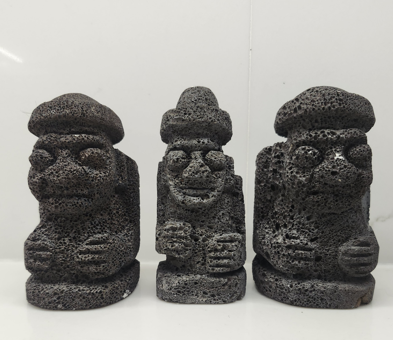 Three Volcanic Rock Statues