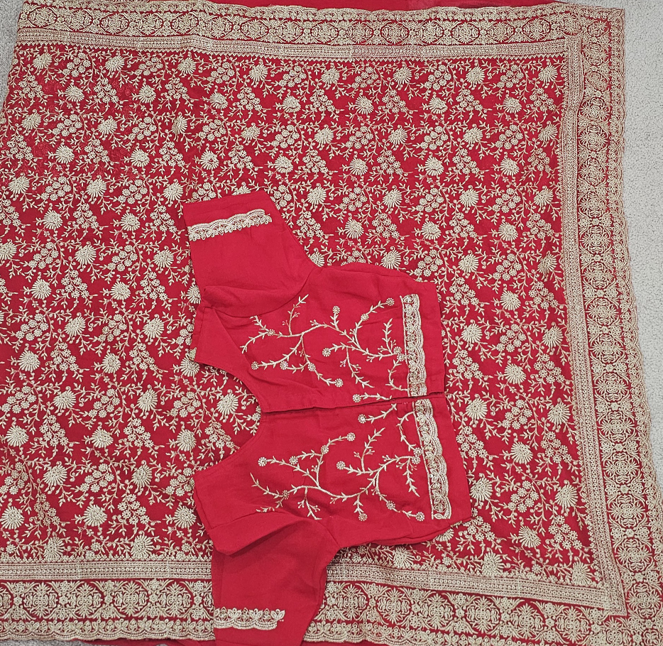 Red embroidered saree with matching blouse
