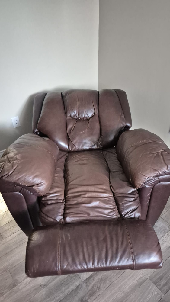 Brown faux Leather Recliner with green cover
