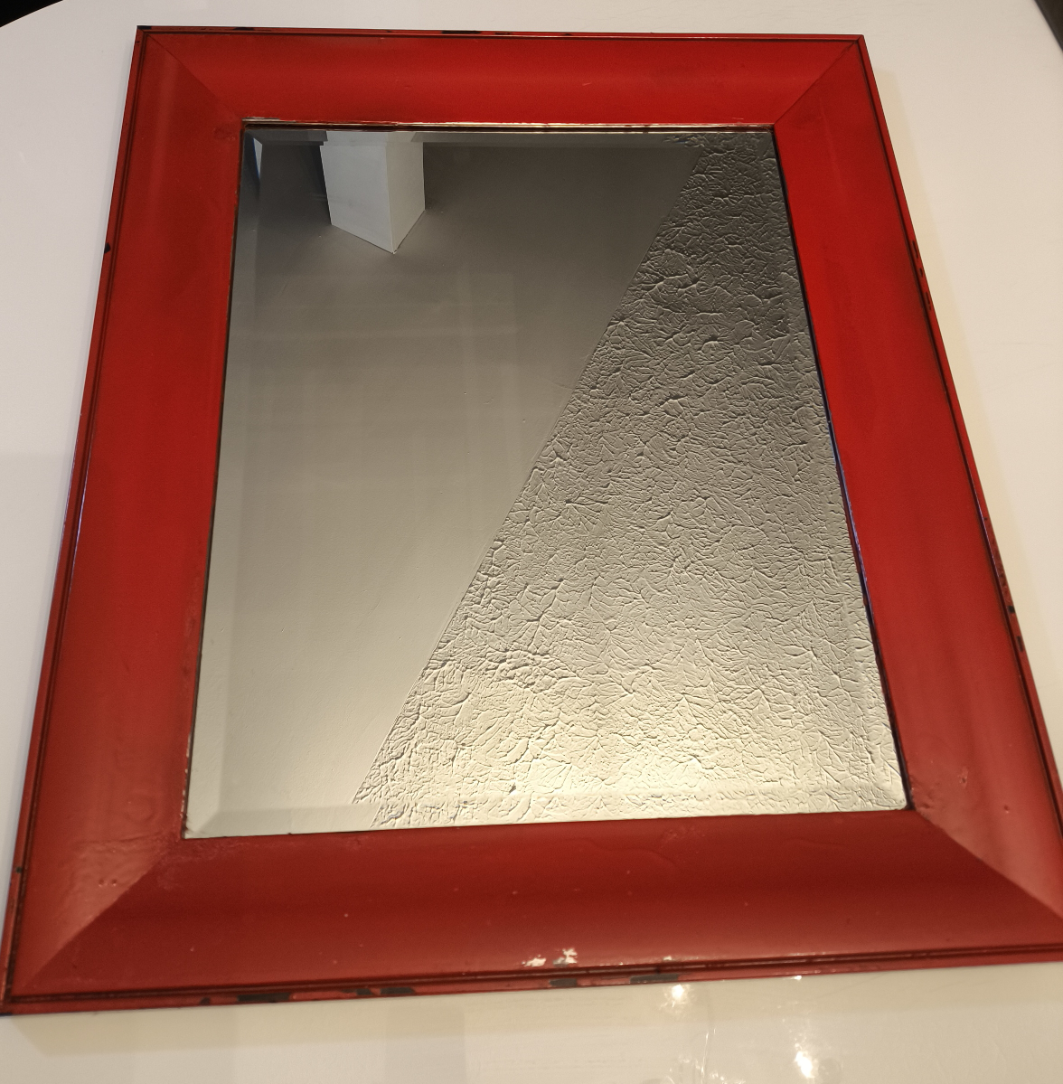 Red framed mirror