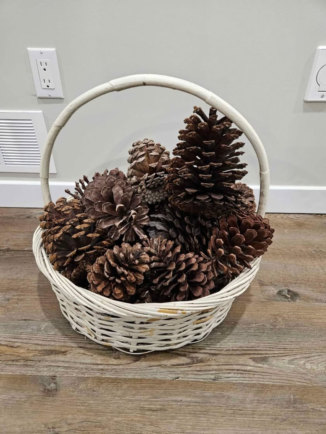 Decorative wicker balls and pine cone basket