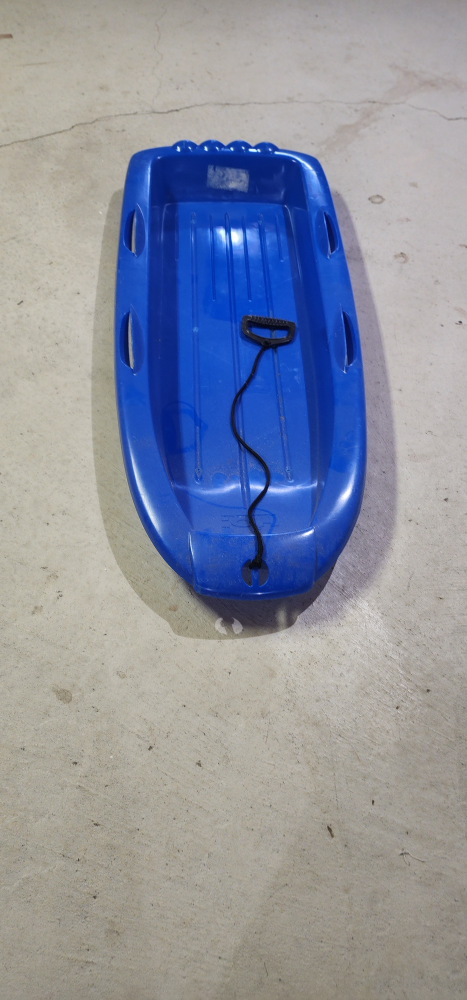 Blue plastic sled