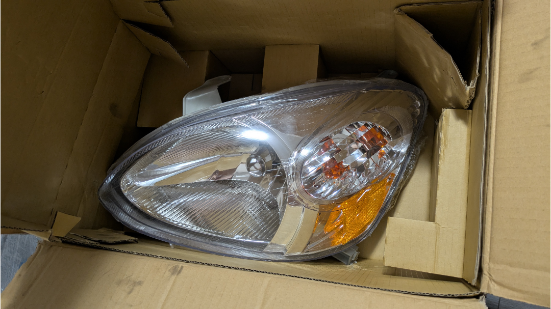 Left headlight for Toyota Echo new in box