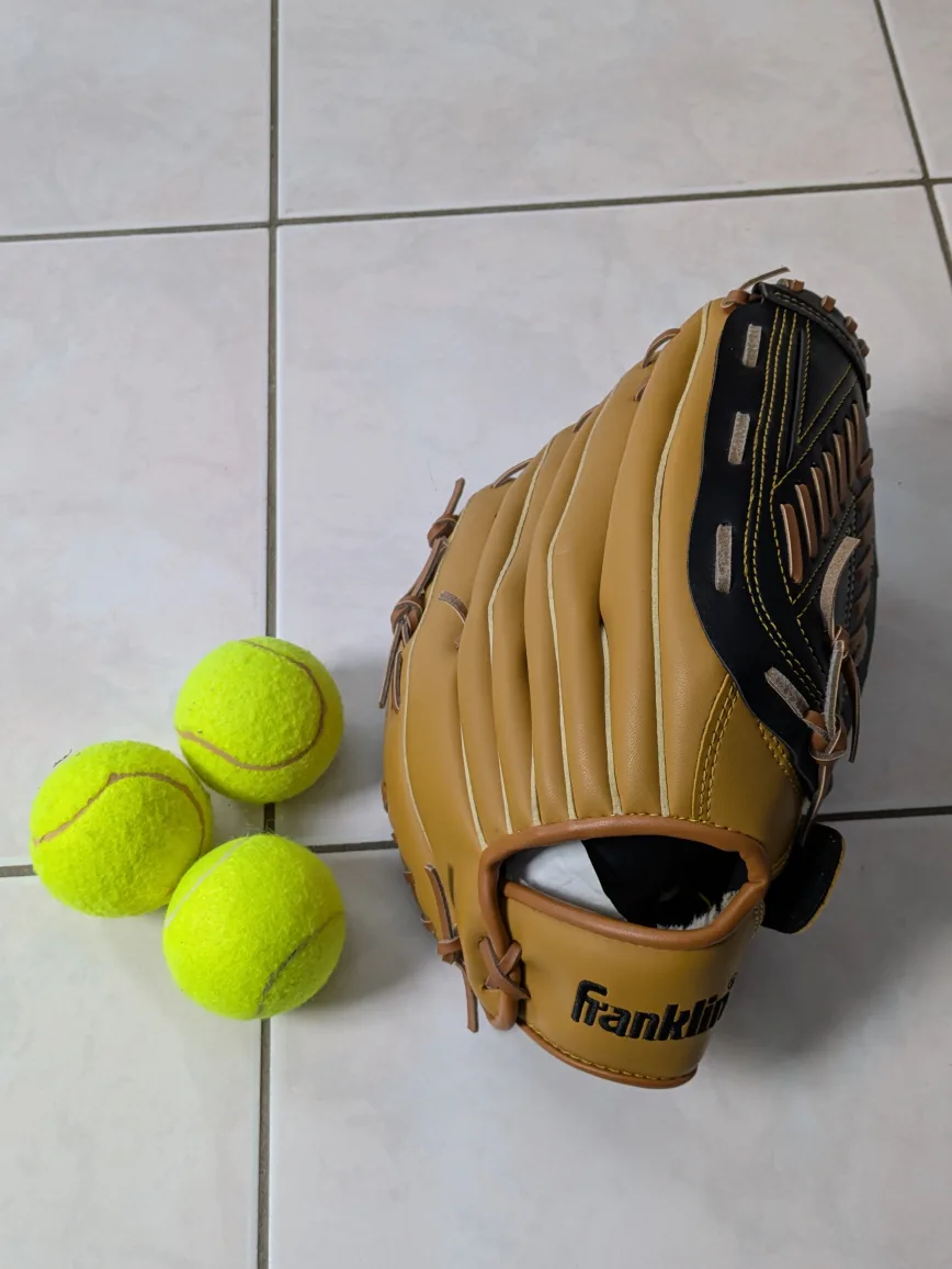 Softball glove and tennis balls thumbnail