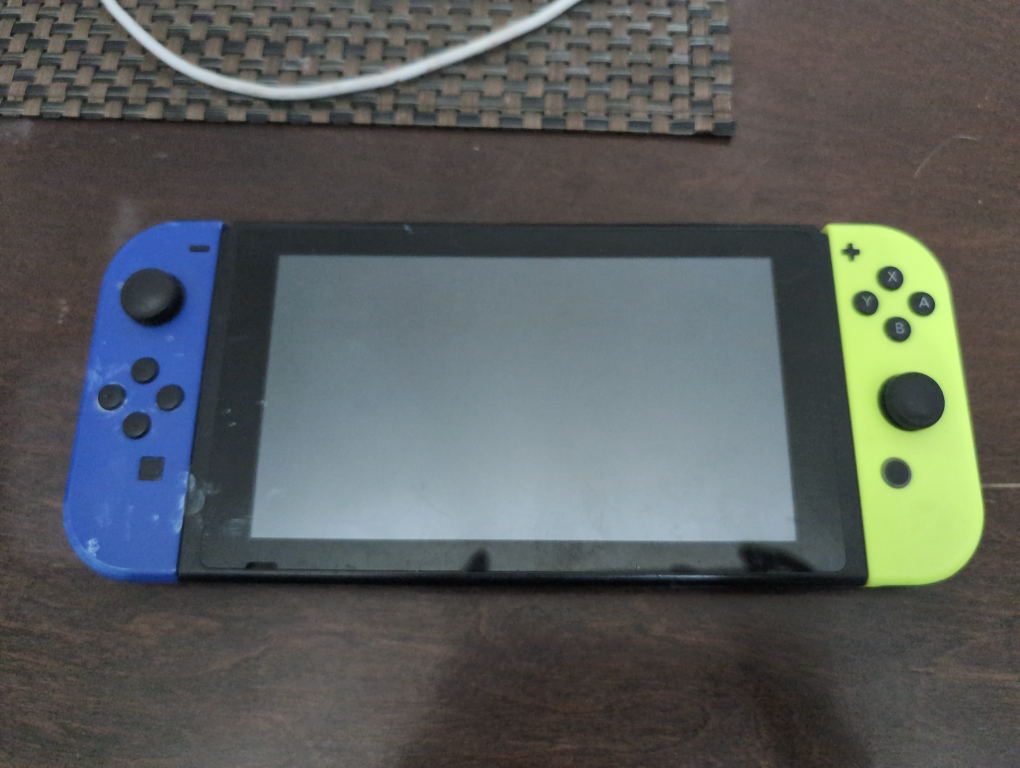Nintendo Switch Console with Neon Blue and Yellow Joy-Cons
