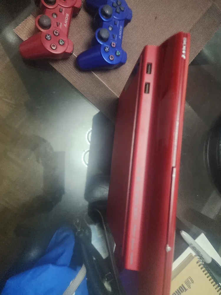 Sony PlayStation 3 Slim Console with 2 Controllers image indicator(4)