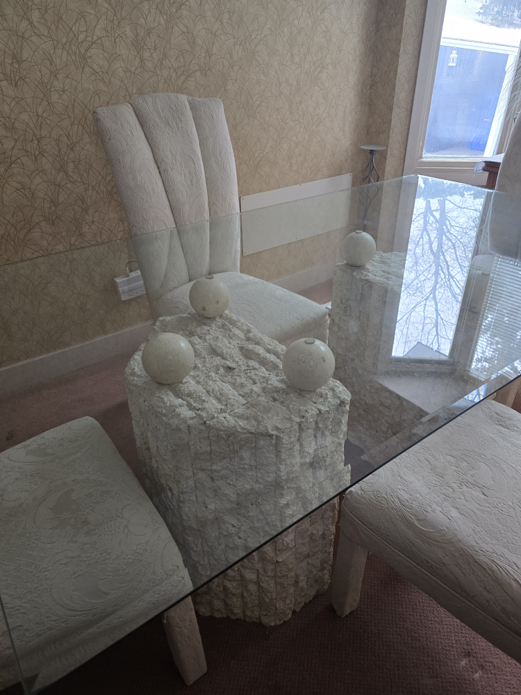 Glass-top dining table with unique stone base and four chairs - photo 3