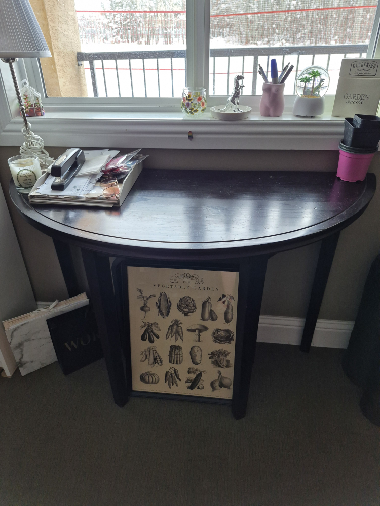 Dark brown half-moon console table