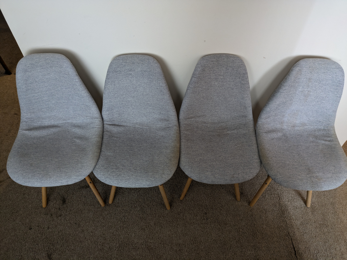 Set of Four Grey Fabric Dining Chairs with Wooden Legs