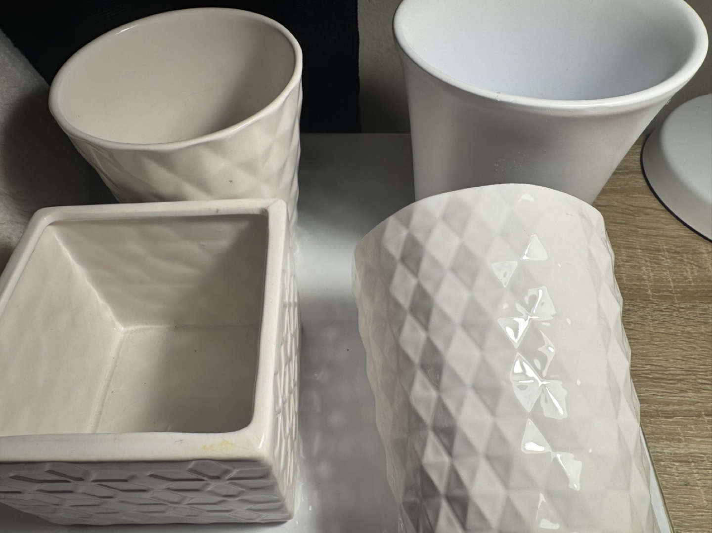 Set of four white ceramic vases